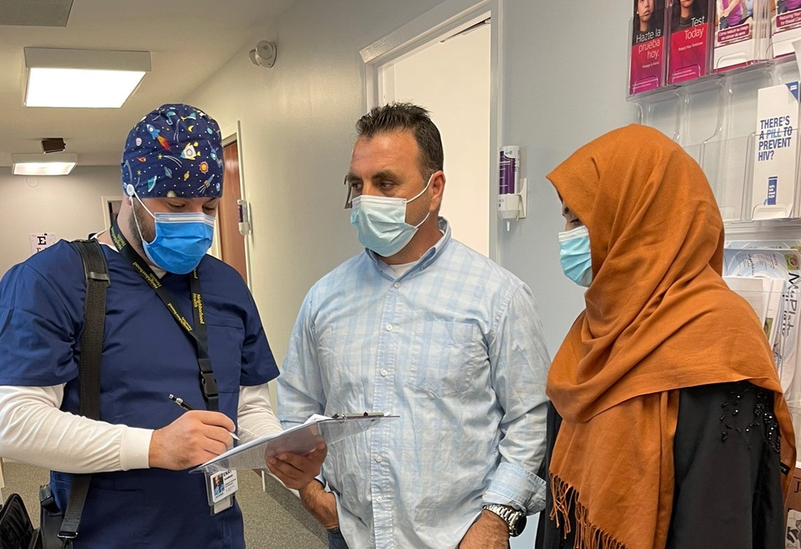 A Dari-Speaking case worker for Neighborhood Health helps refugees navigate care at the doctor's