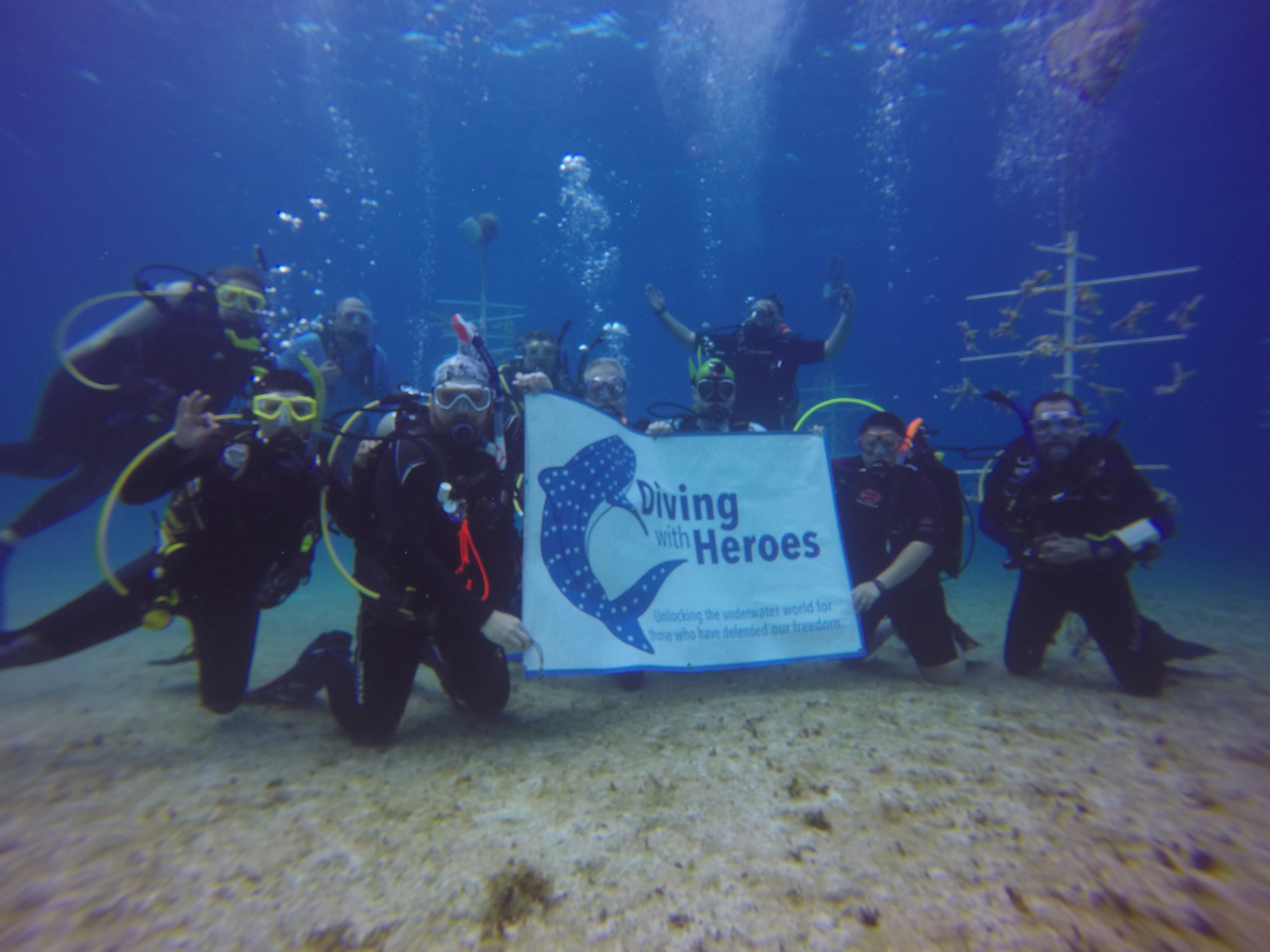 The DWH team after a successful dive in the CCMI coral nursery.