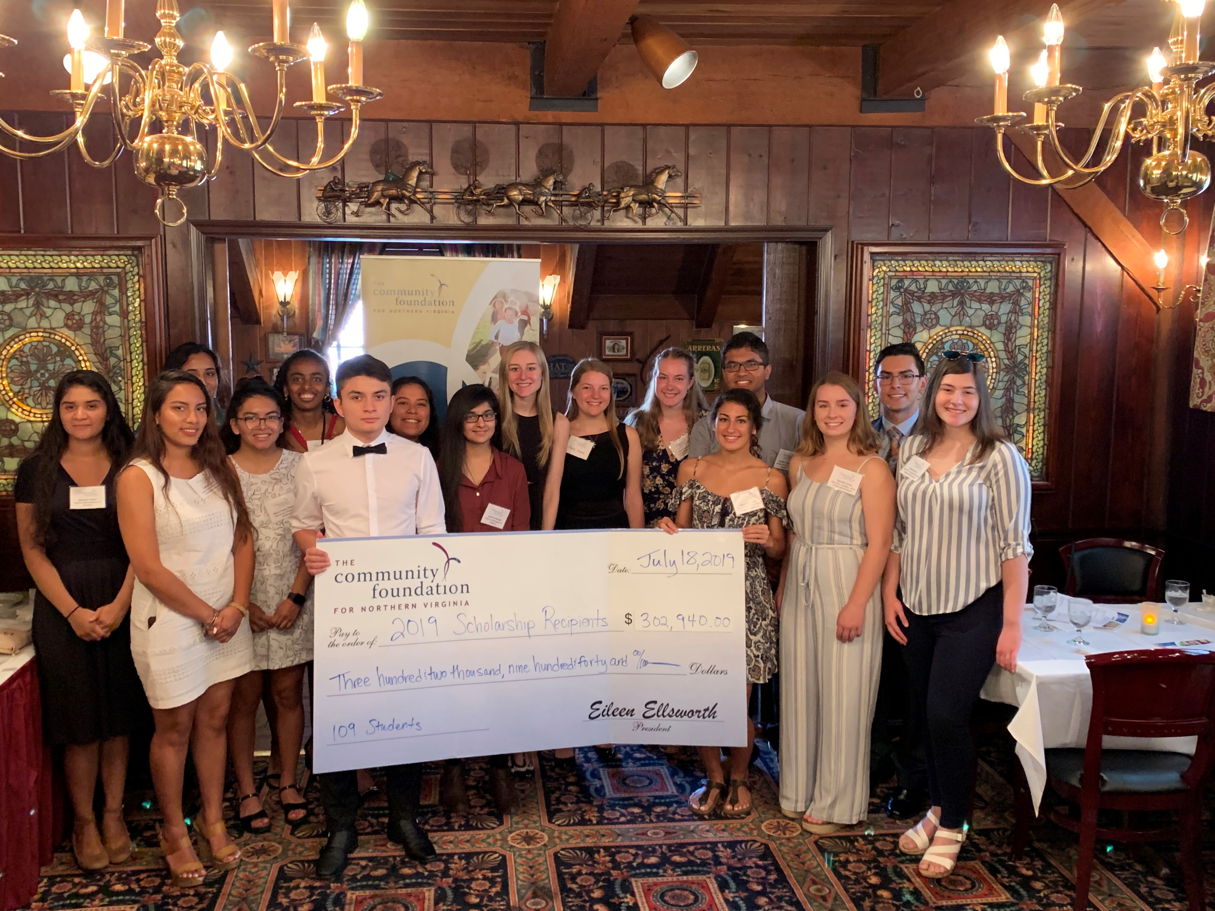 2019 Scholarship recipients group photo with check